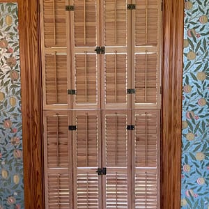 Installed double hung Traditional shutters from Heart Pine Americana DeVenco Shutters